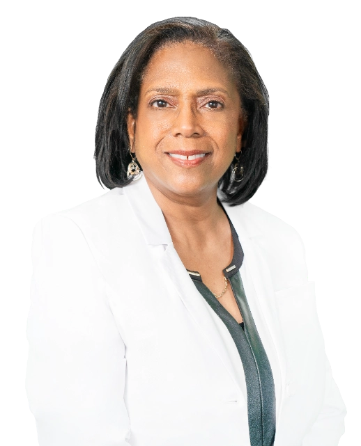This professional headshot features Dr. Lisa Alford wearing a white lab coat over a black top. She is accessorized with a necklace and glasses, presented against a plain black background.